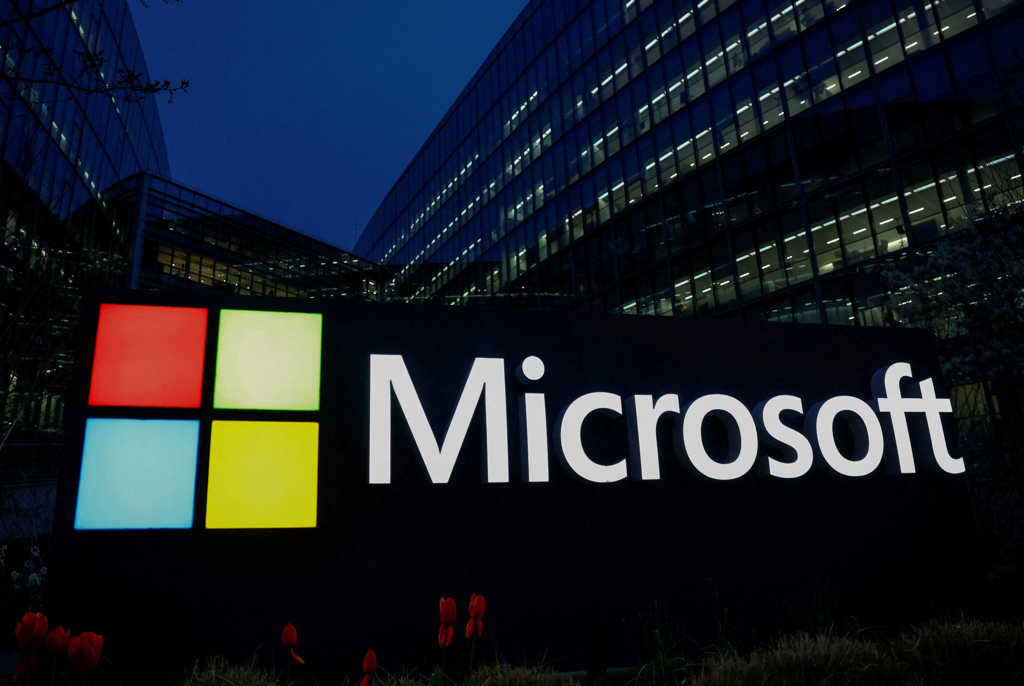 FILE PHOTO: A view shows a Microsoft logo at Microsoft offices in Issy-les-Moulineaux near Paris, France, March 25, 2024. REUTERS/Gonzalo Fuentes/File Photo