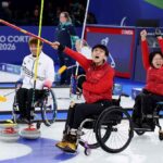 CORTINA D'AMPEZZO, ITALY - MARCH 11: Gold Medallists Jinqiao Yang and Meng Wang of Team People's Republic of China celebrate victory in the Wheelchair Curling Mixed Doubles Gold Medal Match between Team People’s Republic of China and Team Republic of Korea on day five of the Milano Cortina 2026 Winter Paralympic Games at Cortina Curling Olympic Stadium on March 11, 2026 in Cortina d'Ampezzo, Italy. (Photo by Mattia Ozbot/Getty Images)