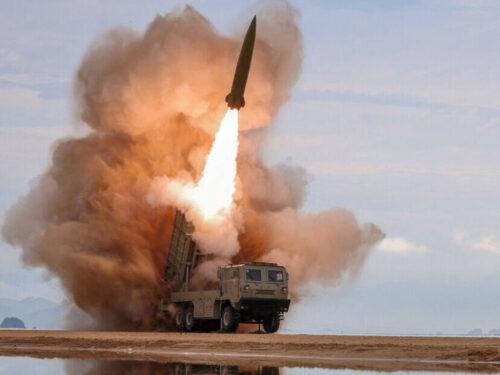FILE PHOTO: A rocket launcher fires a munition during tests, involving an upgraded version of a 240-mm, 24-tube multiple rocket launcher system, tactical ballistic missiles, and a 155-mm self-propelled howitzer, overseen by North Korean leader Kim Jong Un in North Korea, June 25, 2026, in this picture released by North Korea's official Korean Central News Agency.  KCNA via REUTERS    ATTENTION EDITORS - THIS IMAGE WAS PROVIDED BY A THIRD PARTY. REUTERS IS UNABLE TO INDEPENDENTLY VERIFY THIS IMAGE. NO THIRD PARTY SALES. SOUTH KOREA OUT. NO COMMERCIAL OR EDITORIAL SALES IN SOUTH KOREA.     TPX IMAGES OF THE DAY/File Photo